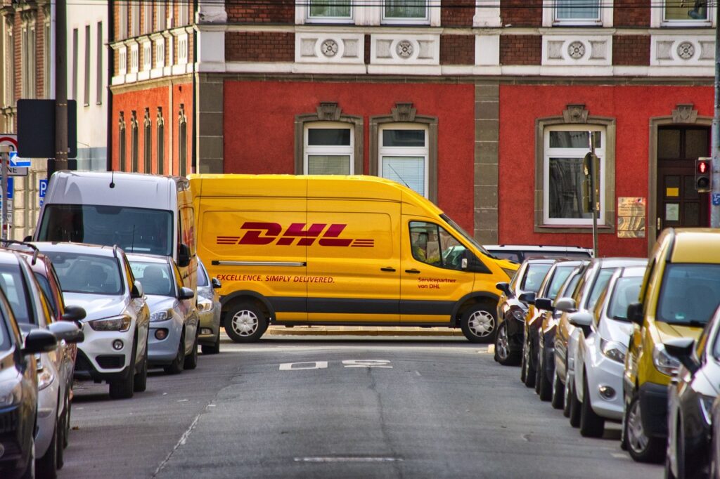 dhl delivery cars street 5739205